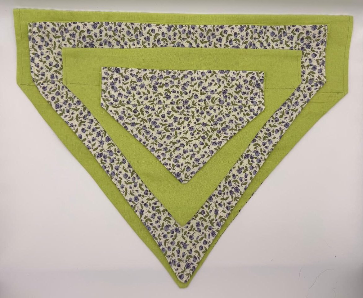 Lilac Fields dog bandana in lime green with delicate lilac floral print border and collar-through sleeve, handmade secure fit