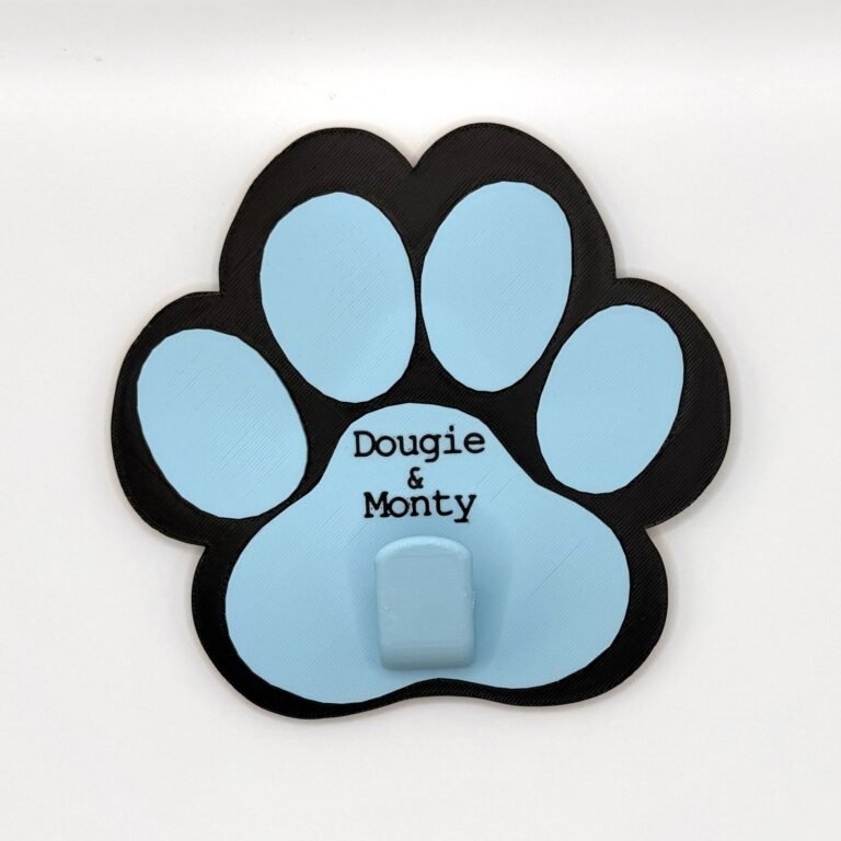 Personalised paw-shaped lead holder in black and baby blue with the names Dougie and Monty