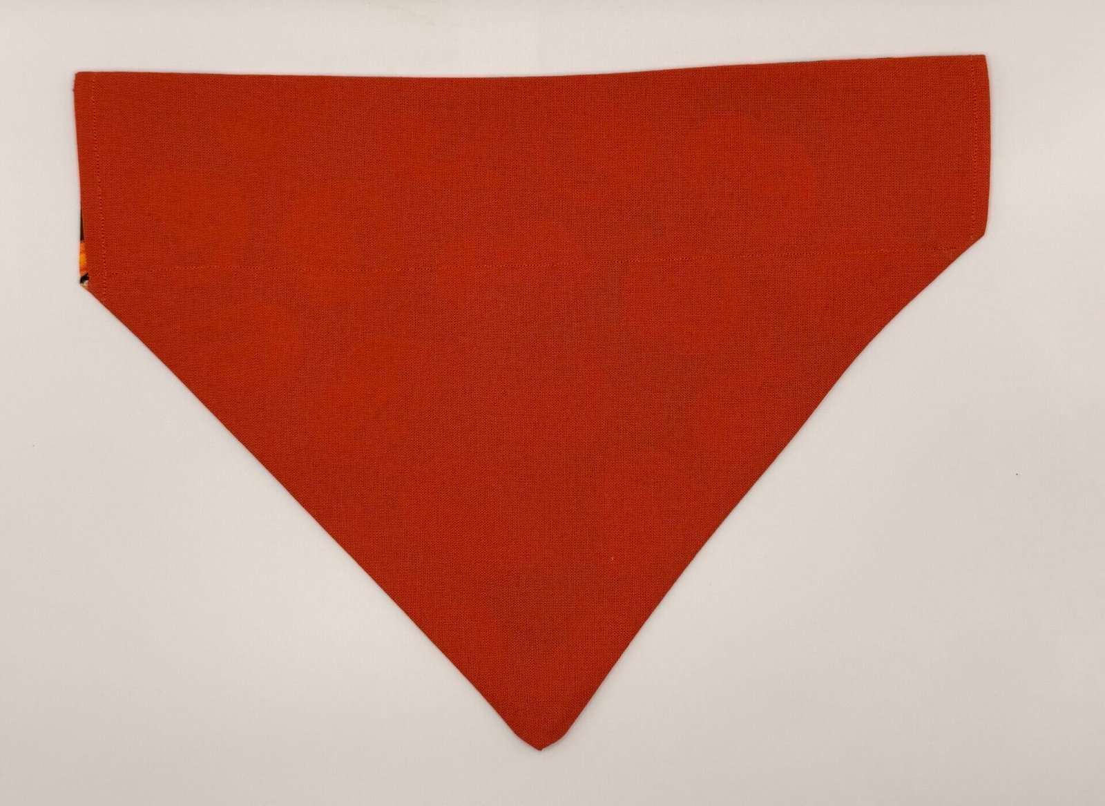 Pumpkin Patch handmade dog bandana in solid pumpkin orange with collar-through sleeve, autumn Halloween sunflower theme